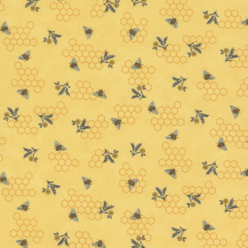 yellow fabric with scattered honeycomb and summery bouquets and bees buzzing across it