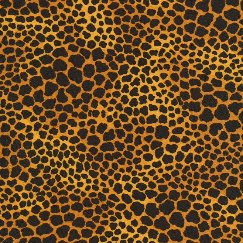 mottled dark gold fabric with black leopard spots in varying sizes all over
