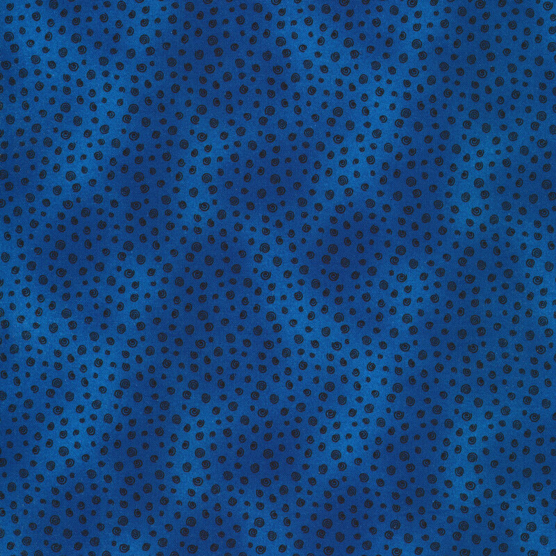 Blue mottled fabric with tiny black swirls all over.