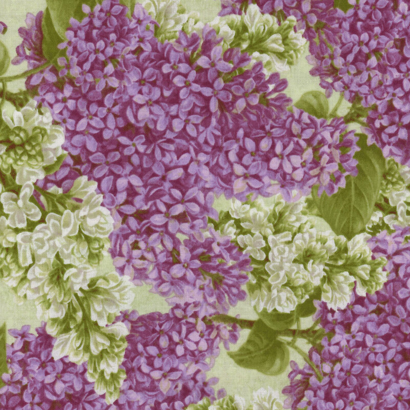 fabric with packed purple and white lilacs and green leaves