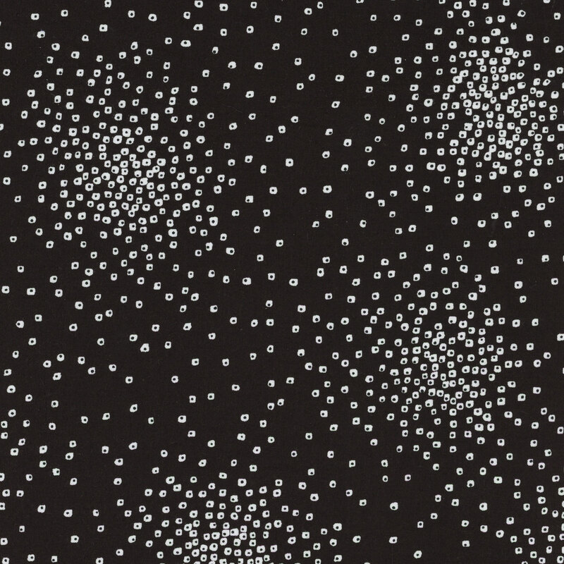 Black fabric with white colored square dots gathered in clusters