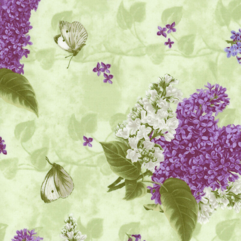 pastel green fabric with tossed lilac bouquets across it