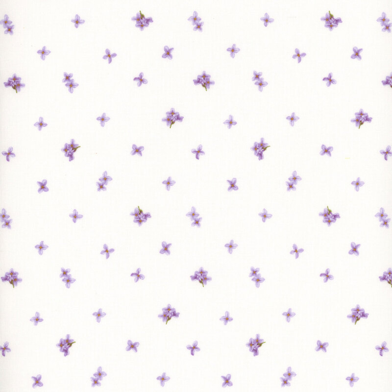 soft white fabric with tossed lilac blossoms across it