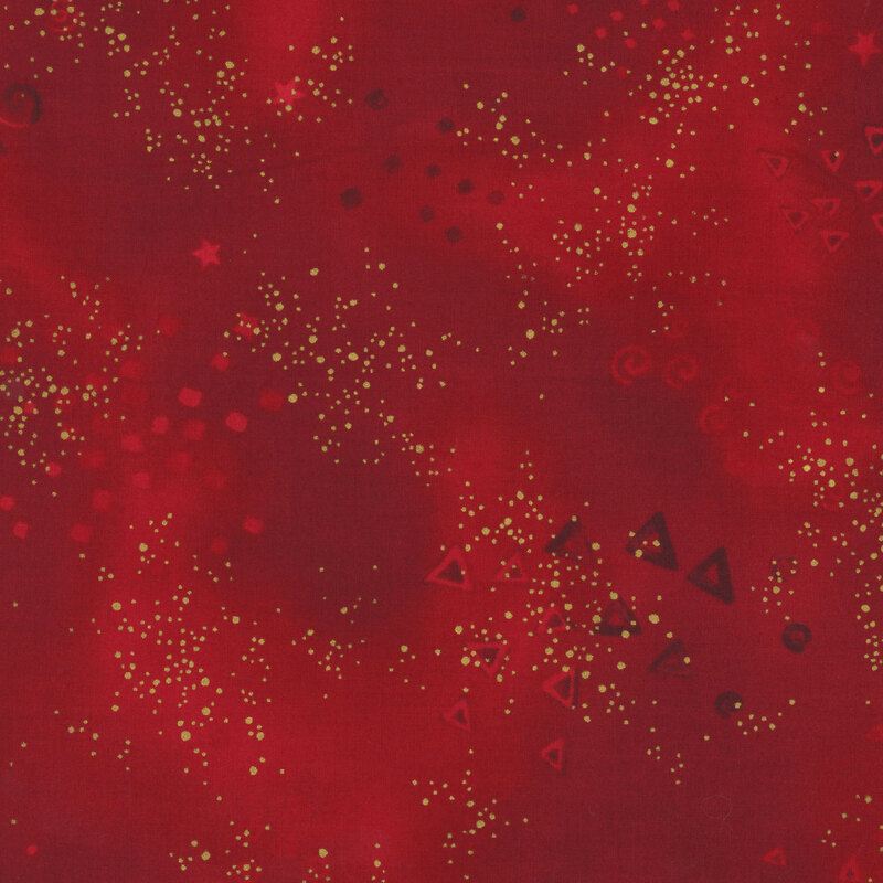 Red mottled fabric with small clusters of light tonal triangles, stars, spirals, and gold metallic flecks