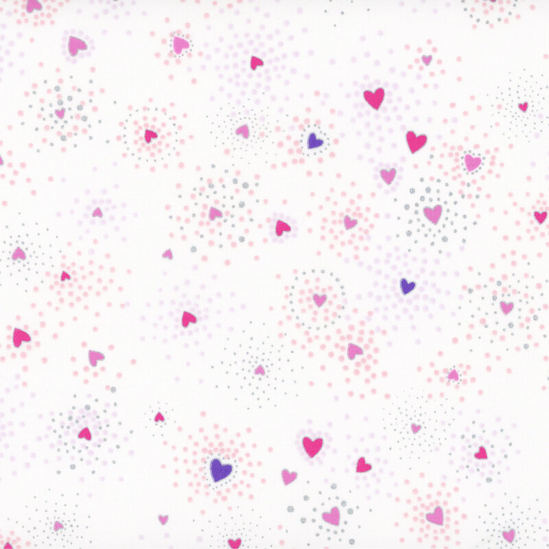 White fabric with pink and purple hearts tossed all over with clustered silver metallic flecks and pink dots