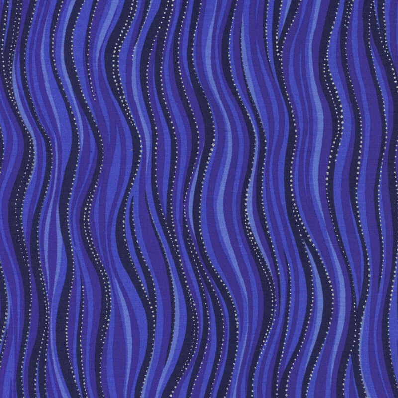 Blue fabric in varying shades with silver dot accents that follow wavy lines 