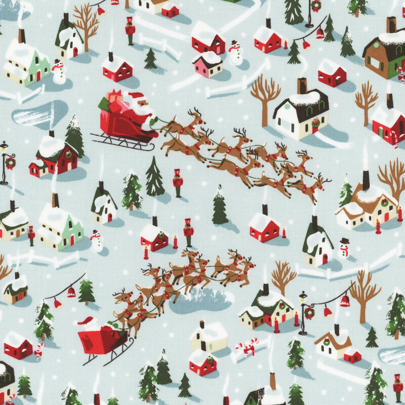 Fabric featuring red, green and white houses in a blanket of mint and white snow with Santa and his reindeer soaring above 