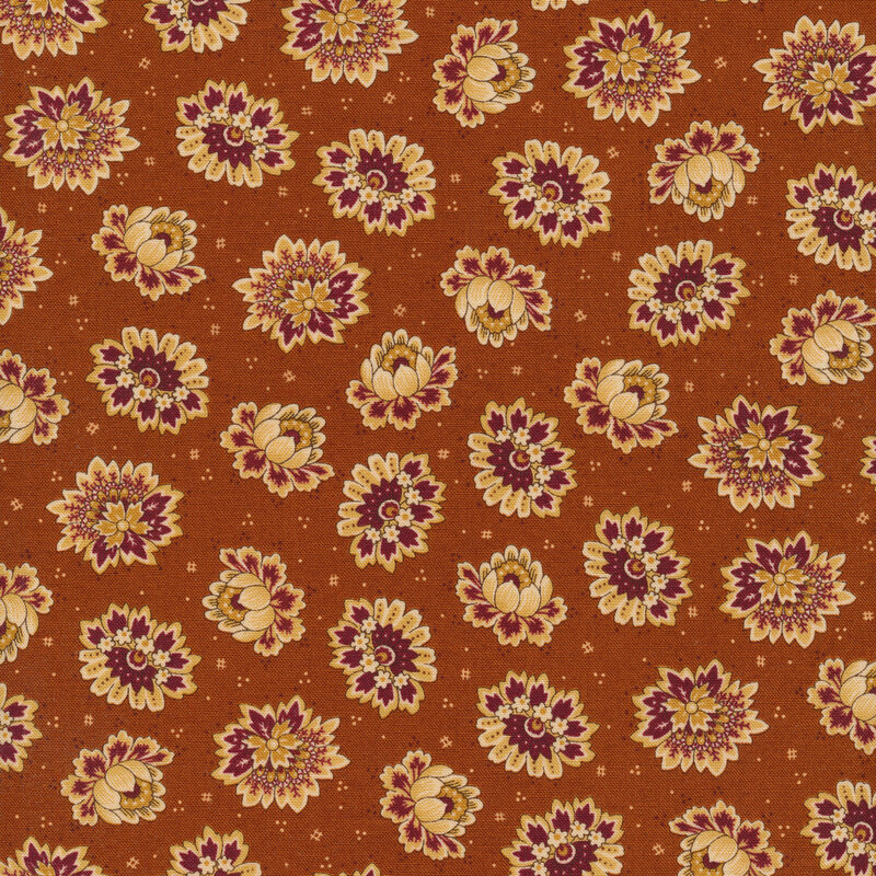 Orange fabric with tan and red tossed flowers and complementary dots