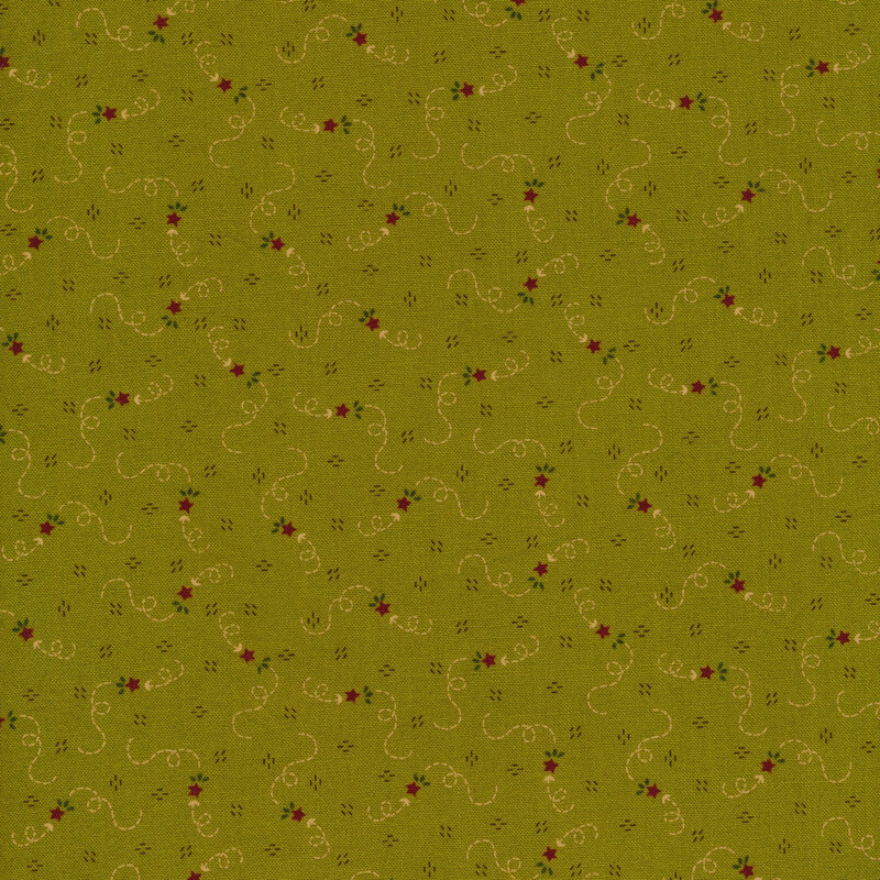 fabric with an olive green background decorated with whimsical meandering red stars and beige trails behind them