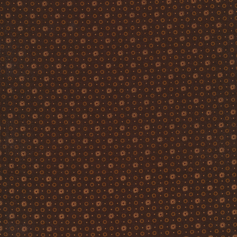 dark brown fabric decorated with circles and small suns