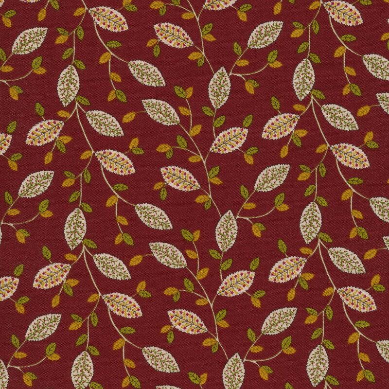 red fabric with beige vines and leaves