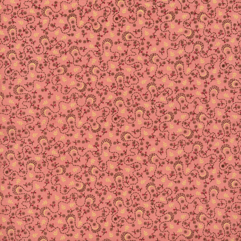 pink colored fabric with tossed leaves and abstract jigsaw vines