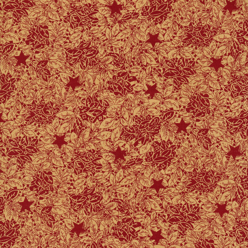 red fabric with beige leaves and red stars across it