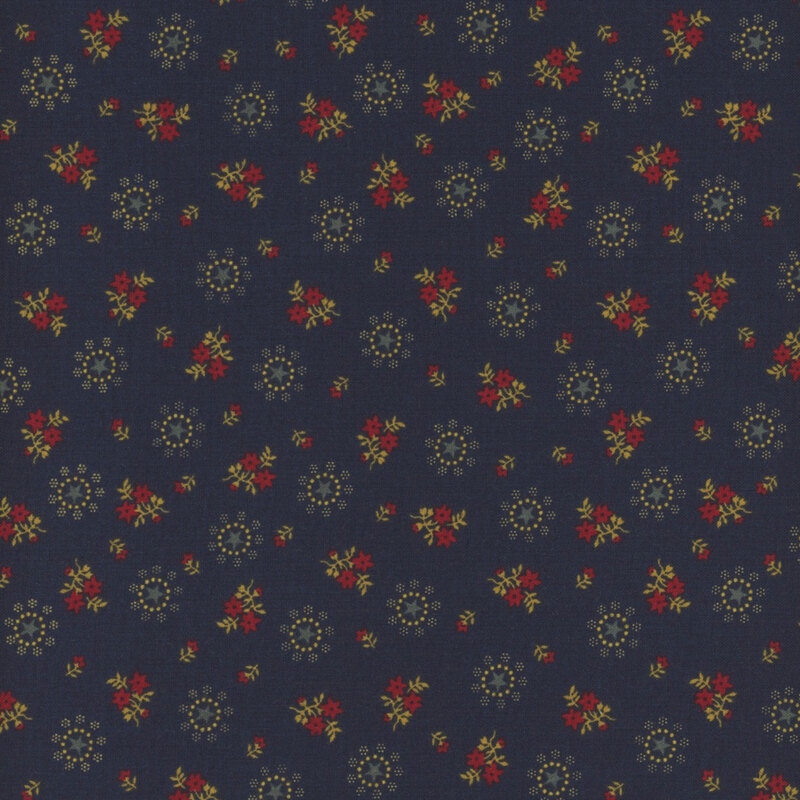 Fabric with star motifs in cream with tan and red floral clusters on a navy blue background.