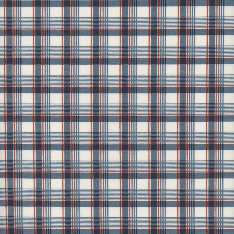 Fabric with a navy blue, red and cream plaid print.