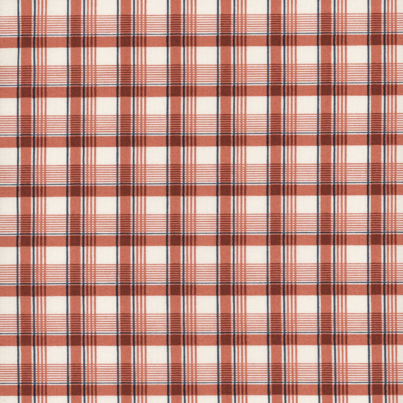 this fabric features a red, navy blue and cream plaid print