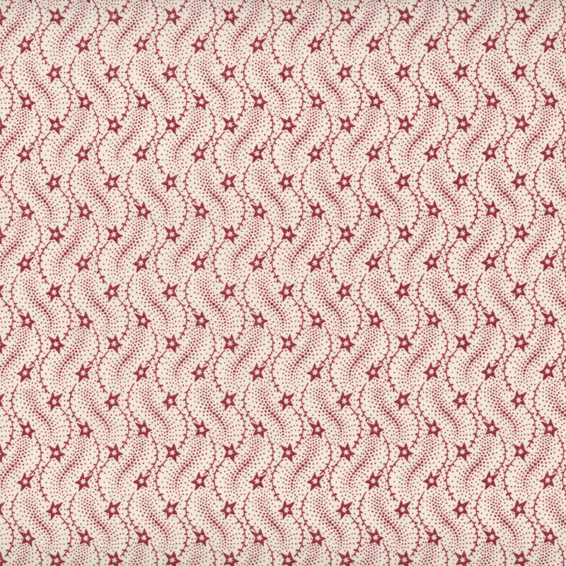 This fabric features a lovely pattern of wavy red lines with red stars on a cream background.