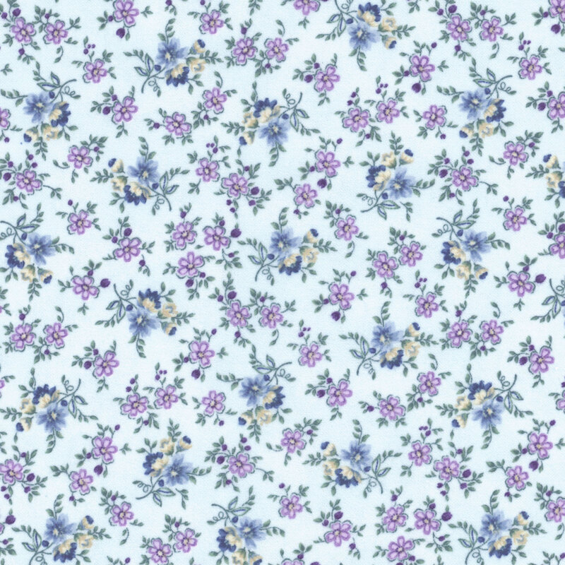 This fabric features vine-y dusty blue, purple and cream flowers on a light blue background.
