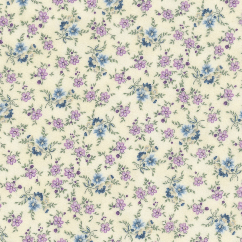 flannel fabric featuring dusty blue, purple, and cream flowers on a vine, with a cream background