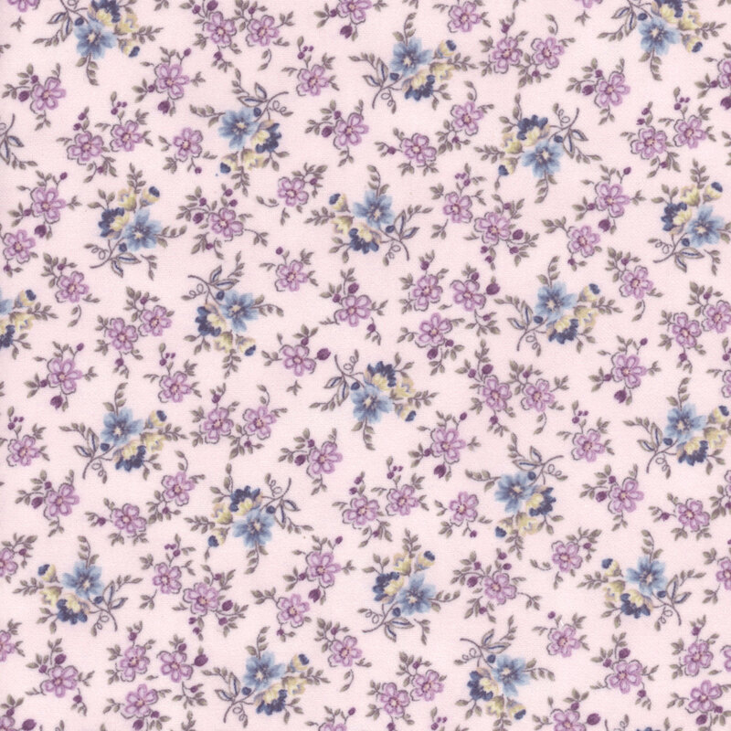 This fabric features vine-y dusty blue, purple and cream flowers on a light purple background.
