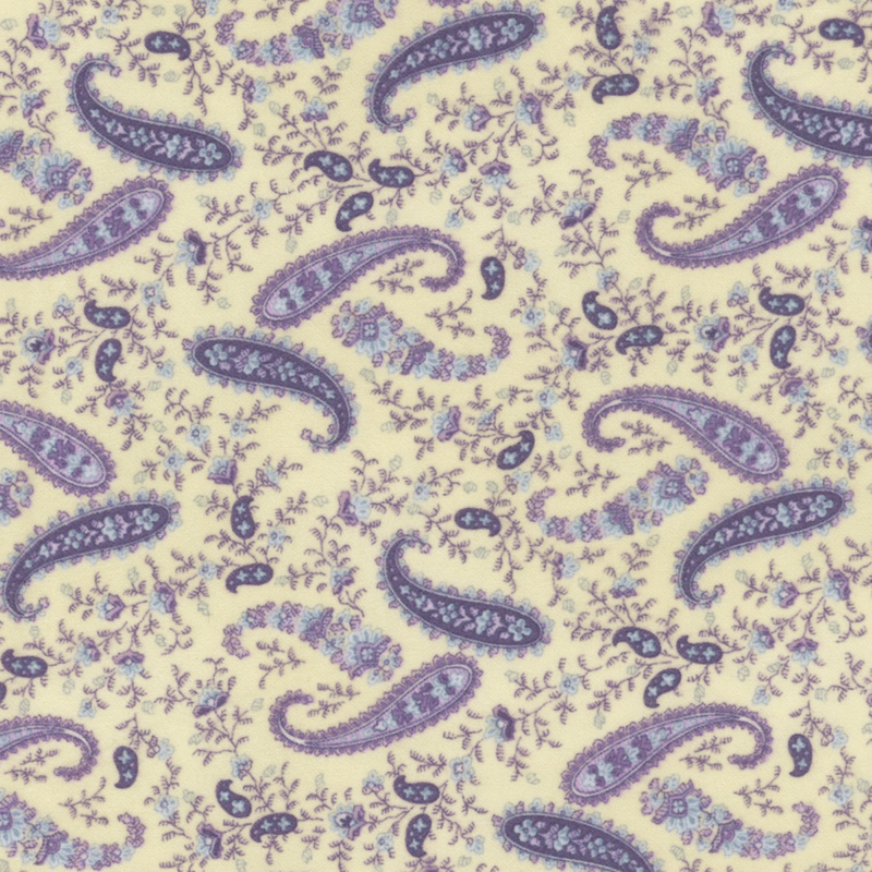 flannel fabric featuring a purple paisley print with small flowers on a solid cream background