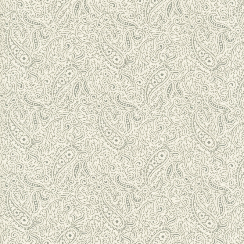 Scan of cream fabric with a light paisley pattern