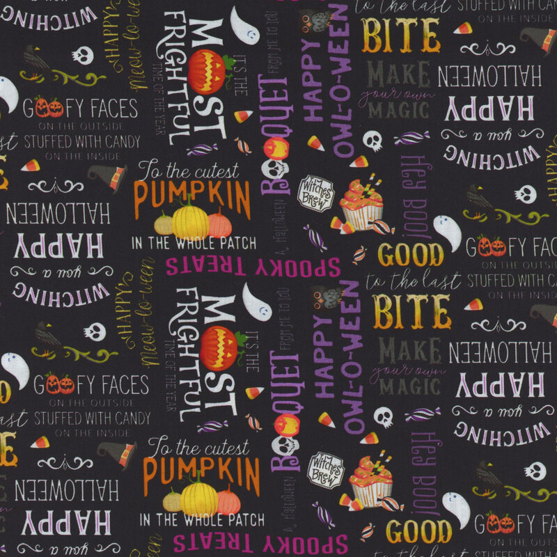black fabric with halloween motifs and sayings across it