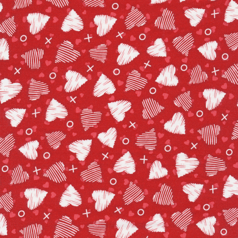 This fabric features white drawn hearts with X's and O's tossed on a red background.