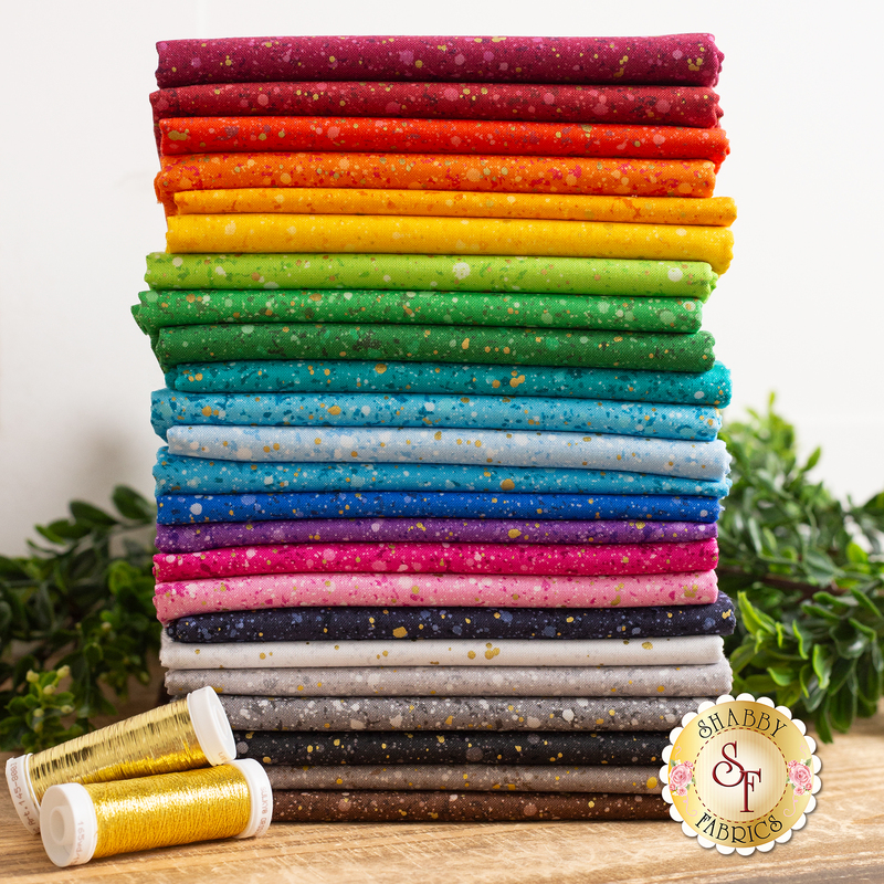 photo of a stack of all fabrics included in Gold Dust fabric collection