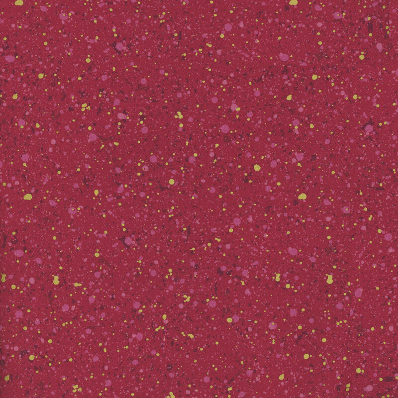This fabric features dark red and gold metallic splatter pattern with a deep raspberry red background.