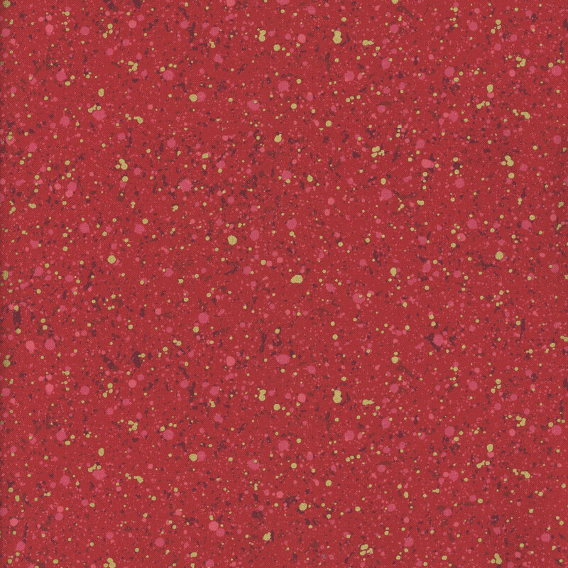 This fabric features dark red and gold metallic splatter pattern with a ruby red background.