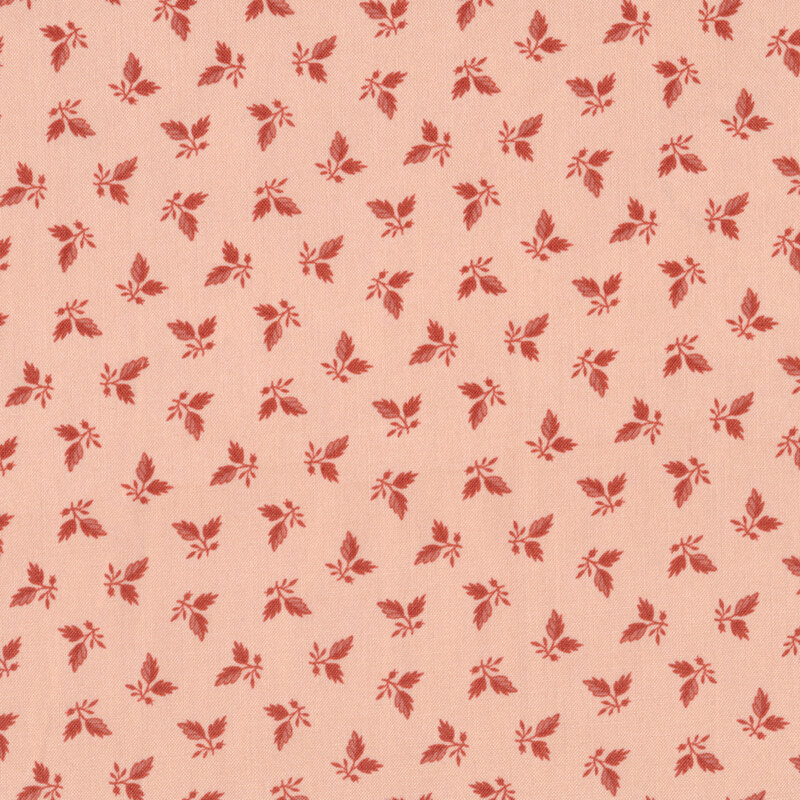 Pink fabric with tossed red ditsy leaves