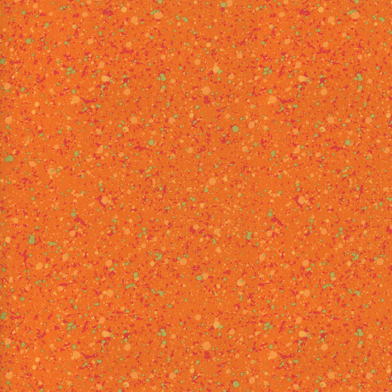 This fabric features a rosy red and gold metallic splatter pattern on a bold orange background.
