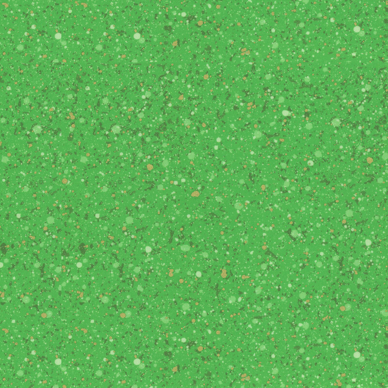 This fabric features a green and gold metallic splatter on a bold green background.