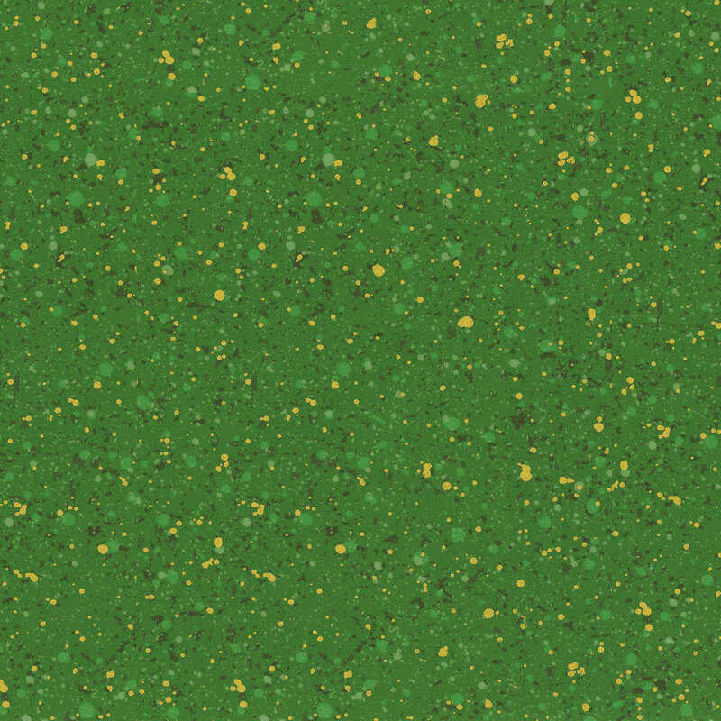 This fabric features dark green and gold metallic splatters on a forest green background.