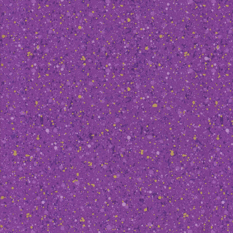 This fabric features dark purple and gold metallic splatter print on a royal purple background.
