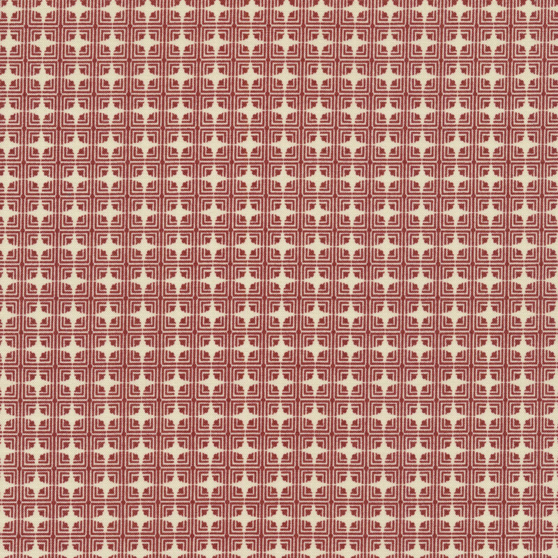 This fabric features red and cream geometric pattern of squares and diamonds.