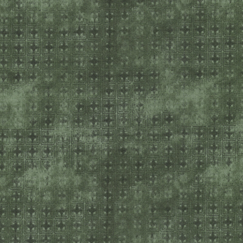 This fabric features sage green and dark green tonal geometric pattern of squares and diamonds.