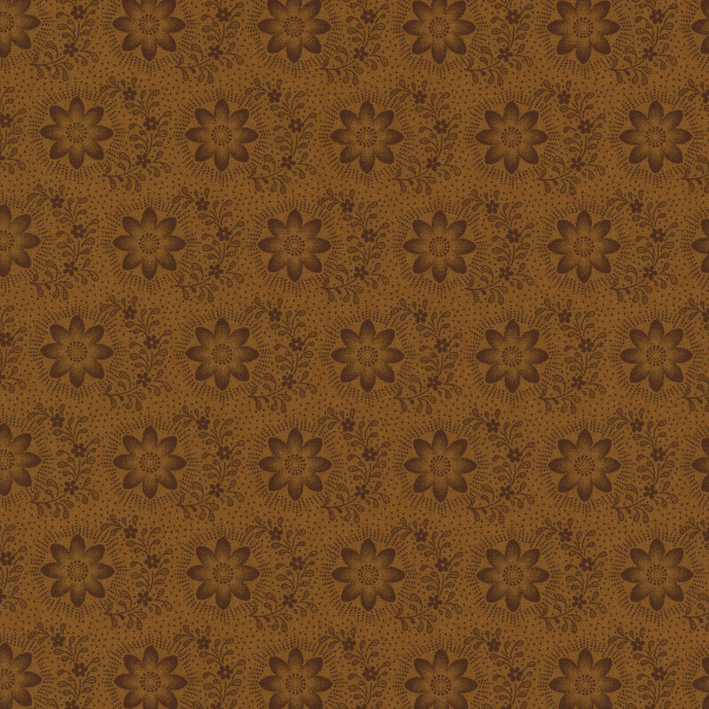 Golden brown fabric with rows of circular dark brown florals and vines all over