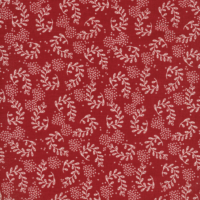 This fabric features vine motifs with texture dots in cream on a dark red background.