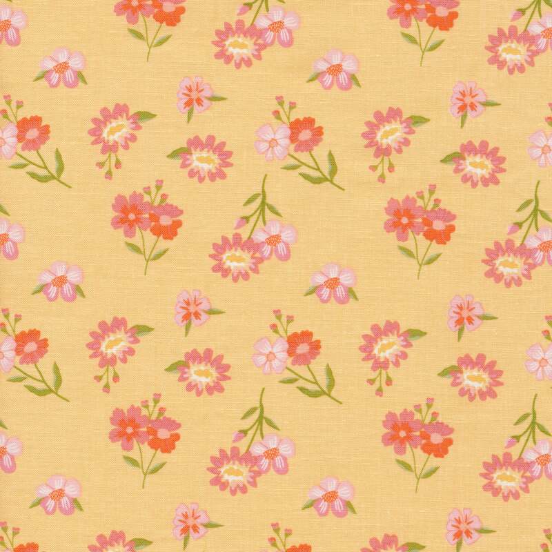 yellow fabric with bright scattered flowers in blue, orange, and yellow.