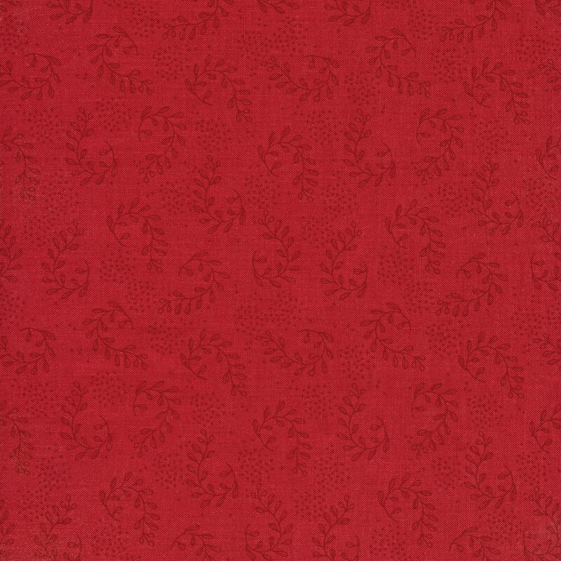 This fabric features vine motifs with texture dots in dark red on a red background.