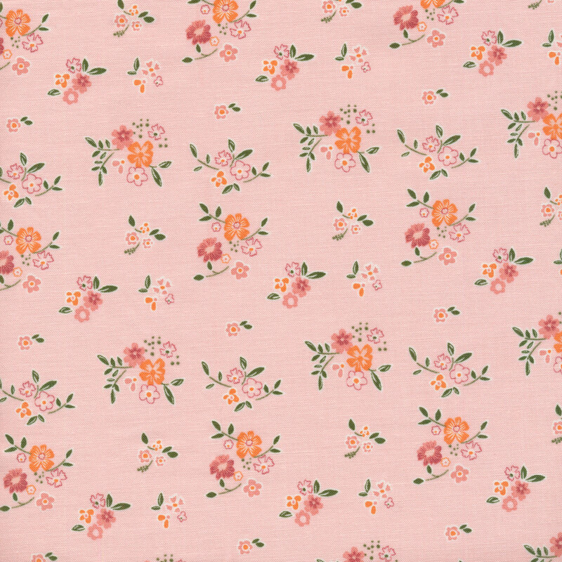 light pink colored fabric with scattered clusters of flowers and leaves scattered across it