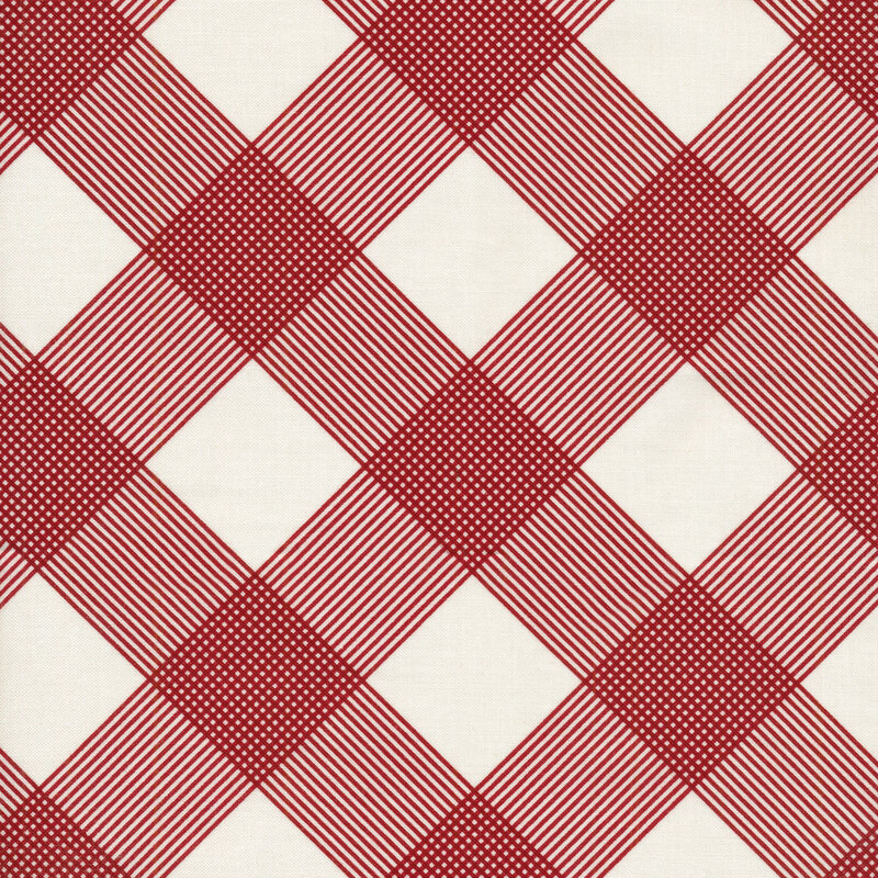this fabric features a red plaid print on a solid cream background.