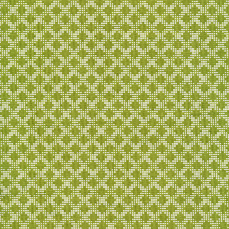 Green fabric with a cream-colored geometric diamond design reminiscent of textiles.