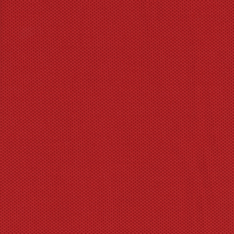 red fabric featuring a dotted halftone tonal print
