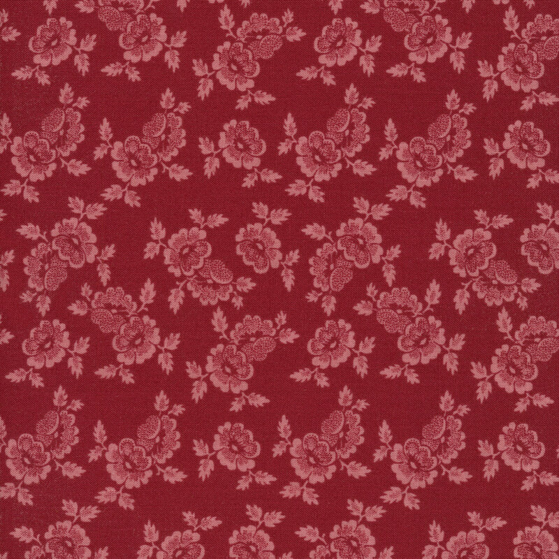 This fabric features a lovely pattern of red flower clusters on a dark red background.