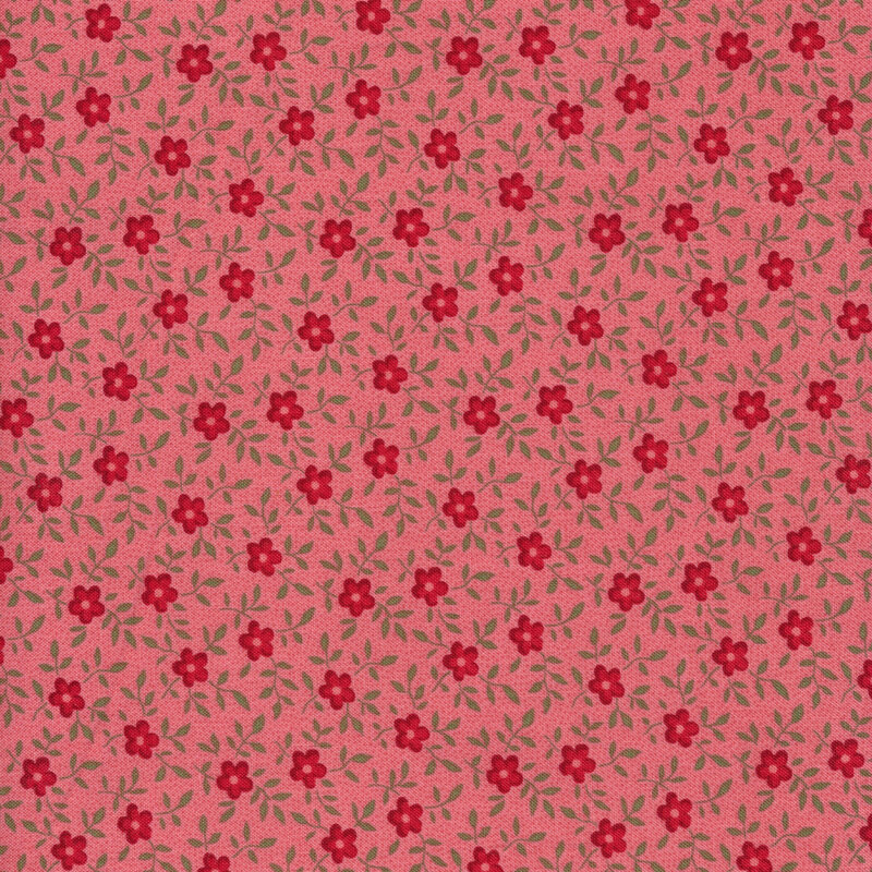 This fabric features bright pink flowers tossed with light green vines on a solid rosy pink background.
