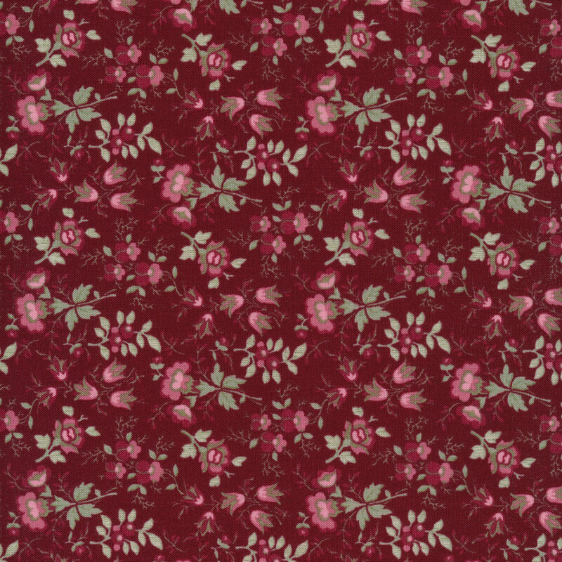 This fabric features delicate florals and vines in rosy pink flowers and green leaves on a solid dark red background.