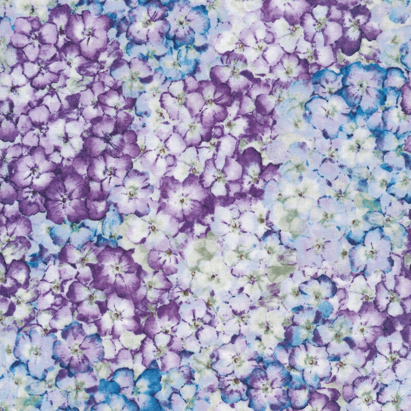 Pale blue fabric with packed blue and purple florals all over.